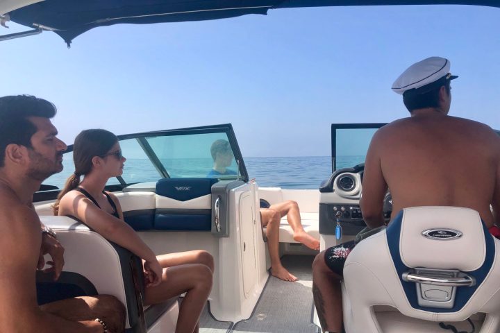 a group of people sitting on a boat
