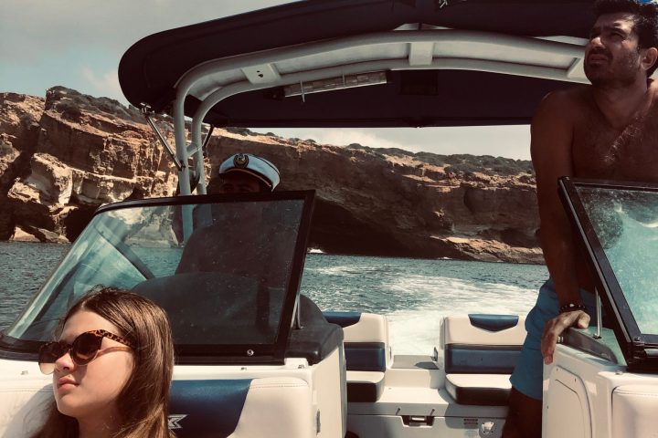 a man and a woman sitting on a boat