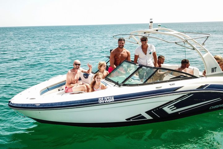 a group of people on a boat in the water