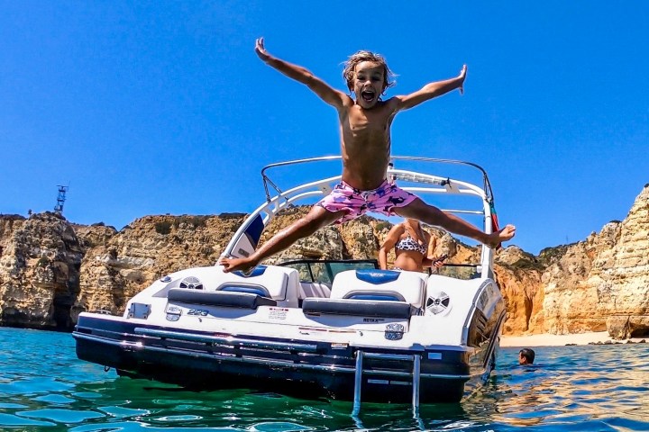 a person riding on the back of a boat
