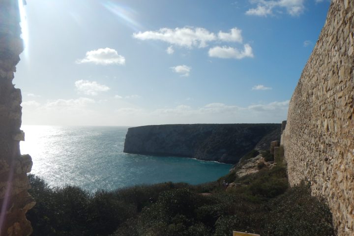 a body of water with a mountain in the background