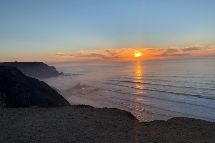 a sunset over a body of water