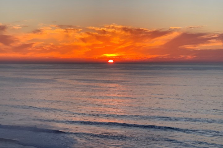 a sunset over a beach